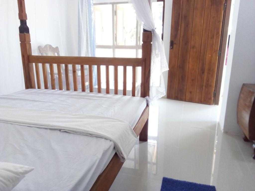 Postel nebo postele na pokoji v ubytování T & U Homestay