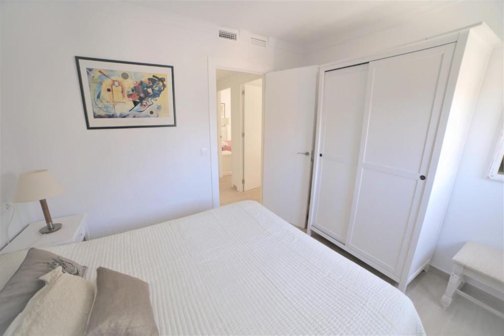Posteľ alebo postele v izbe v ubytovaní APARTAMENTO RIALTO 2
