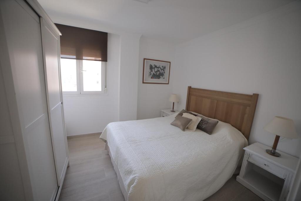 Posteľ alebo postele v izbe v ubytovaní APARTAMENTO RIALTO 2