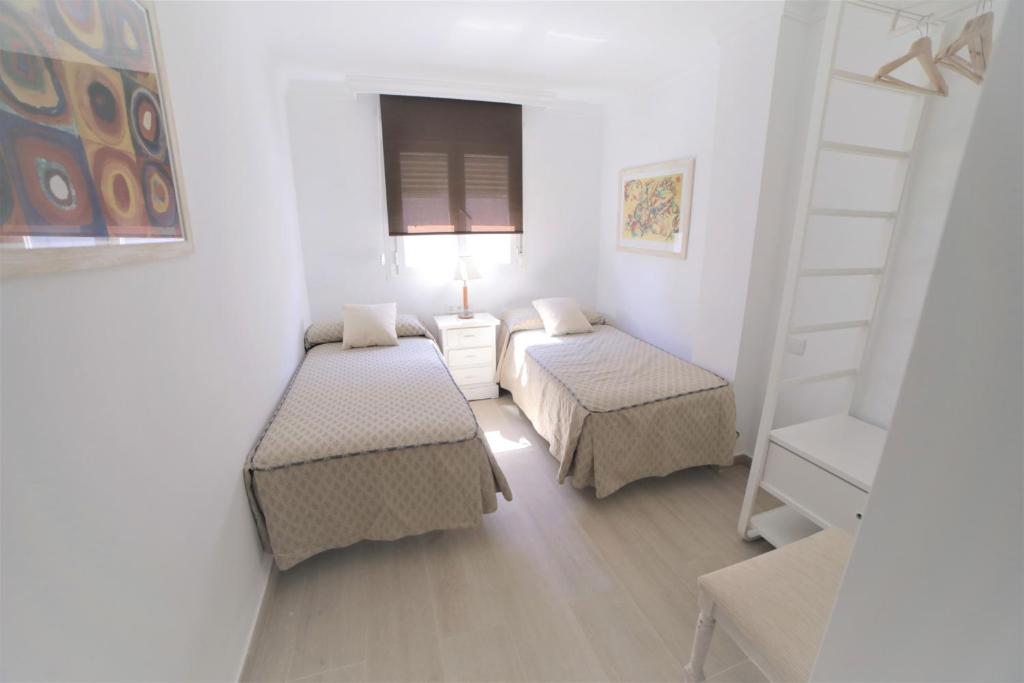 Posteľ alebo postele v izbe v ubytovaní APARTAMENTO RIALTO 2