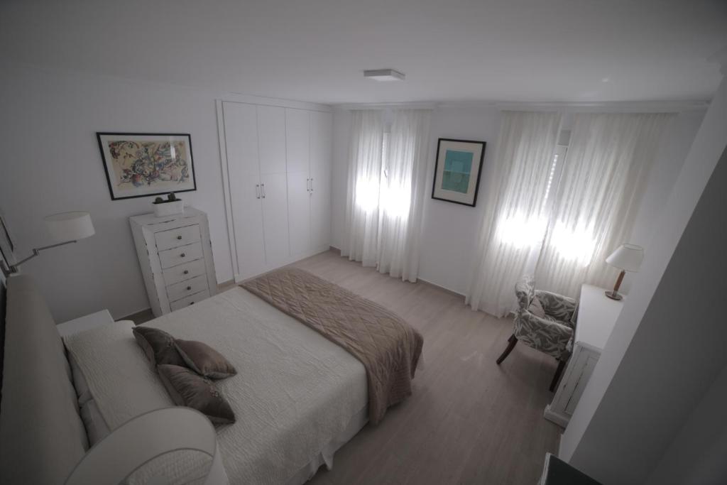 Posteľ alebo postele v izbe v ubytovaní APARTAMENTO RIALTO 2