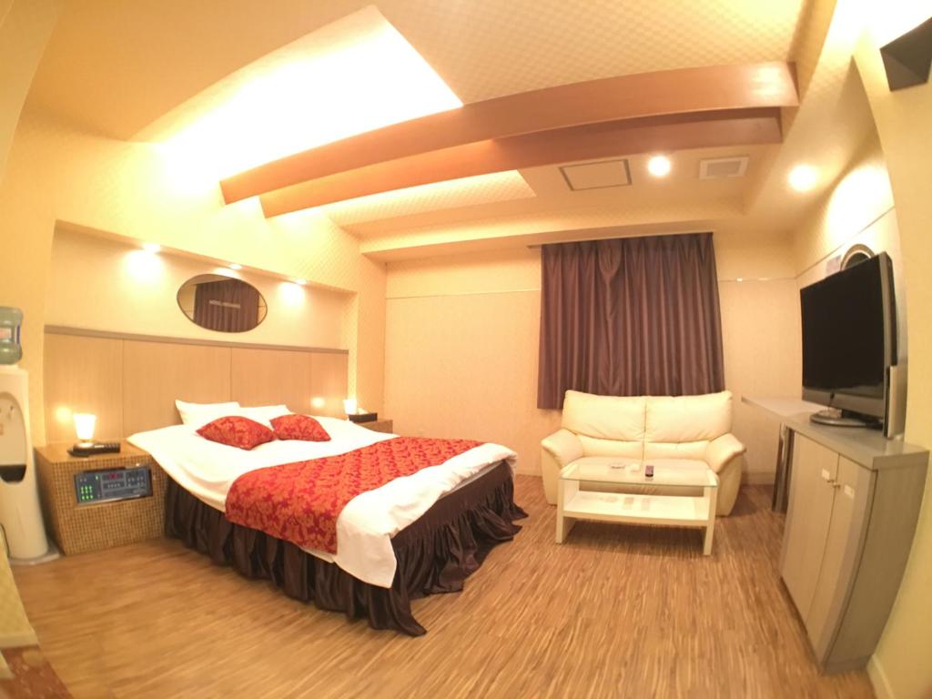 Postel nebo postele na pokoji v ubytování Hotel Orchid (Adult only)