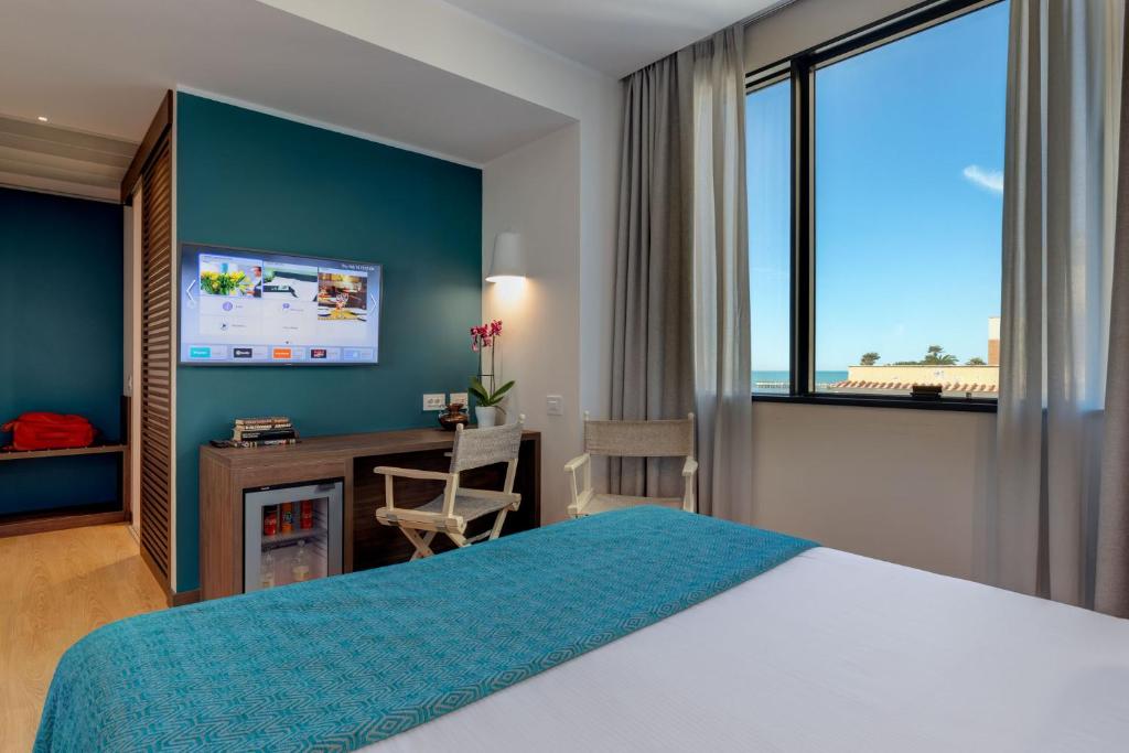 Postel nebo postele na pokoji v ubytování Fly Decó Hotel