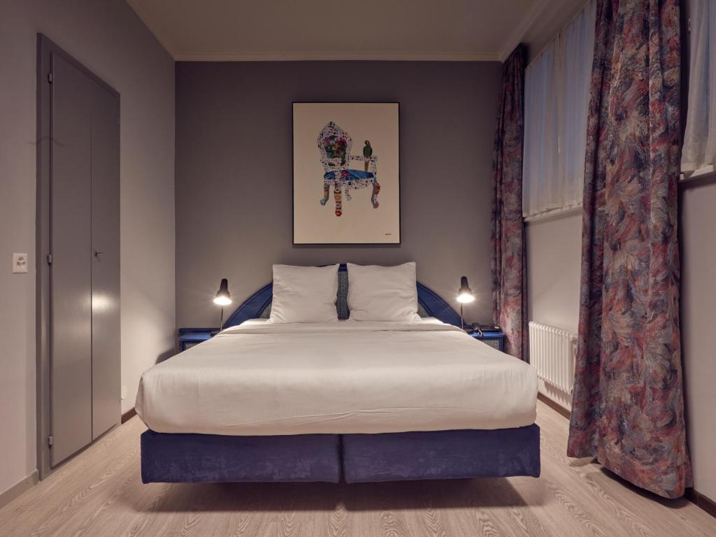 Postel nebo postele na pokoji v ubytování Hôtel Crystal