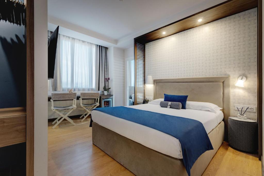 Postel nebo postele na pokoji v ubytování Fly Decó Hotel