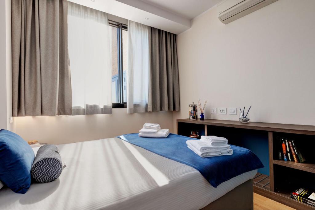 Postel nebo postele na pokoji v ubytování Fly Decó Hotel