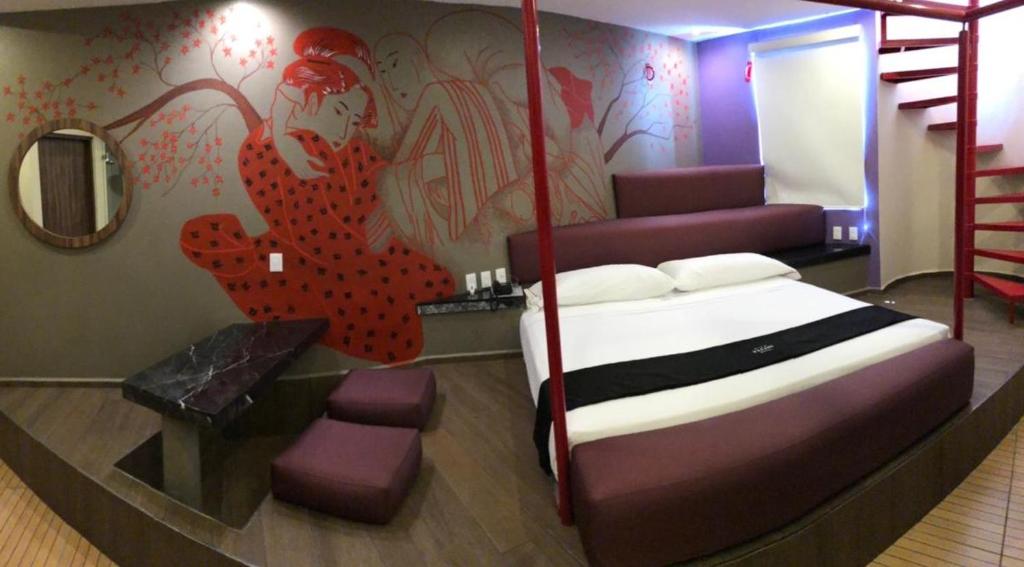En eller flere senger på et rom på Motel Tatami