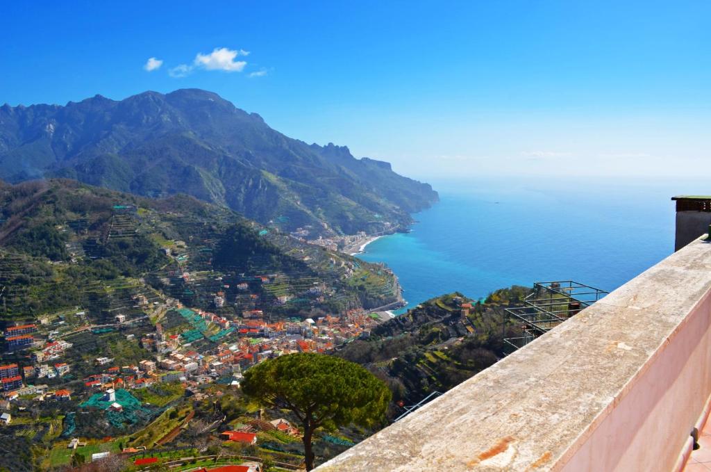 a view of the amalfi coast from the edge of a cliff at Palazzo Mansi in Ravello