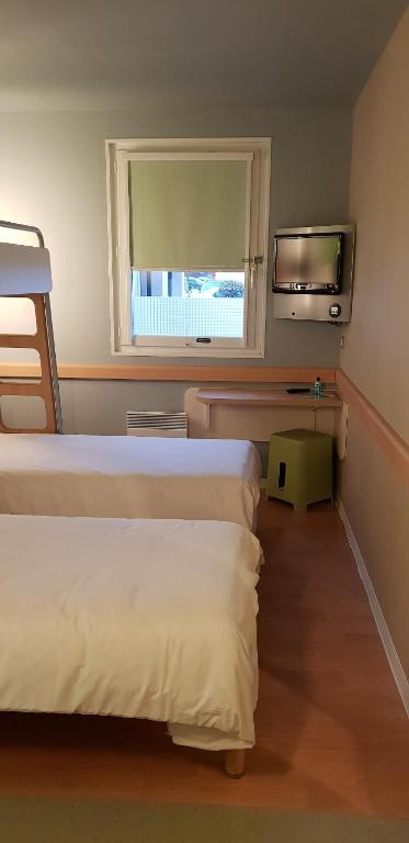 Postel nebo postele na pokoji v ubytování Ibis budget Verdun