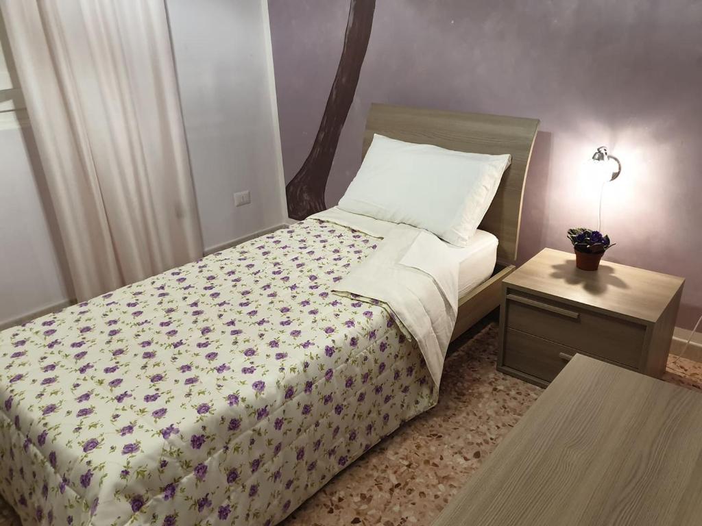 A bed or beds in a room at B&B La Dimora dei Professori