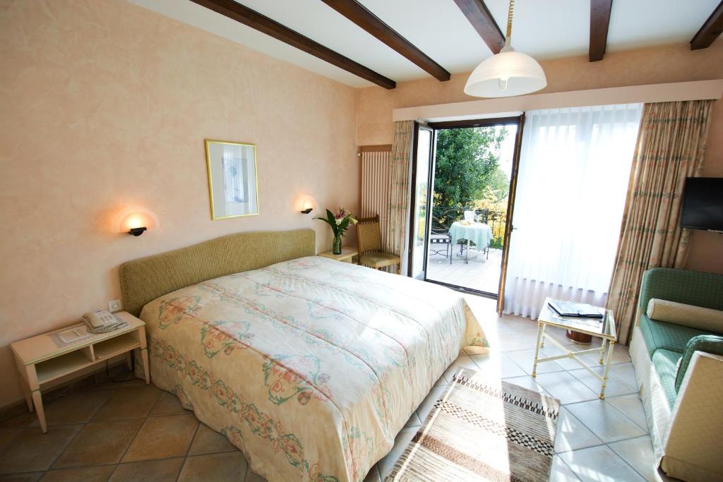 Postel nebo postele na pokoji v ubytování Romantik Hotel Castello Seeschloss