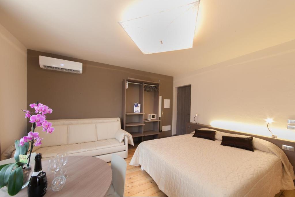 Posteľ alebo postele v izbe v ubytovaní International Rooms & Apartments