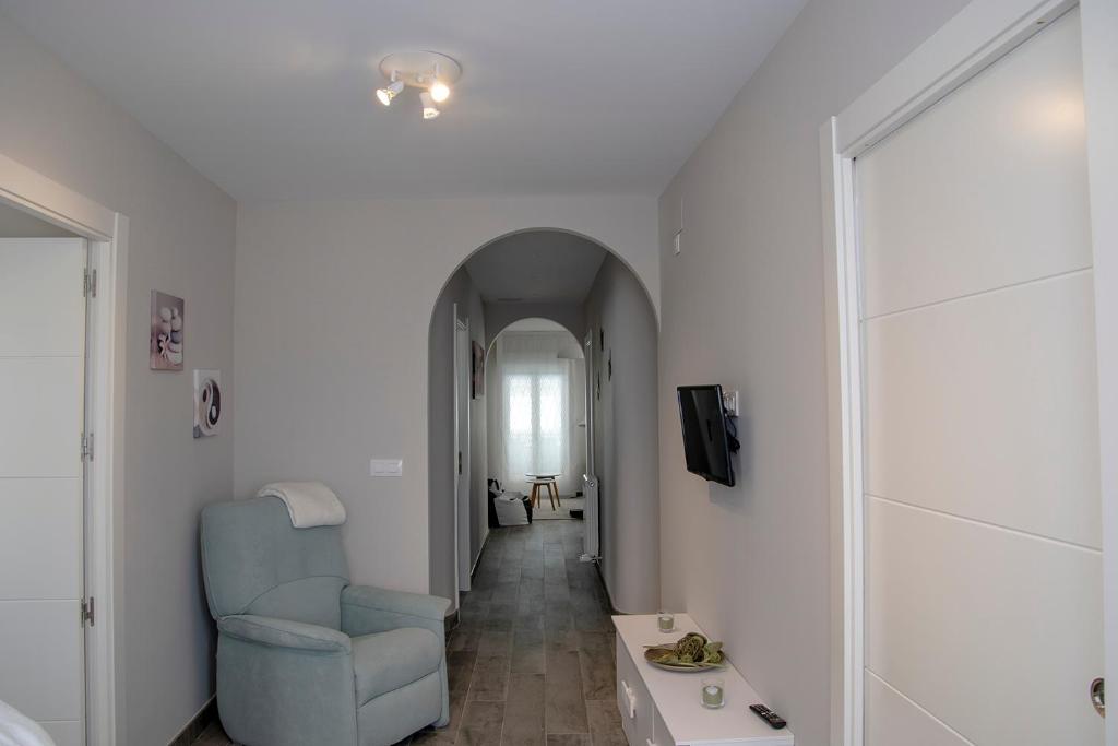 Televízia a/alebo spoločenská miestnosť v ubytovaní Alojamiento Turistico La Casa del tio Cesar
