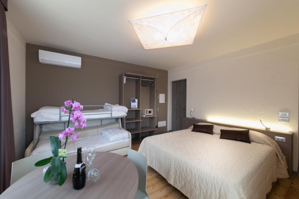 Posteľ alebo postele v izbe v ubytovaní International Rooms & Apartments