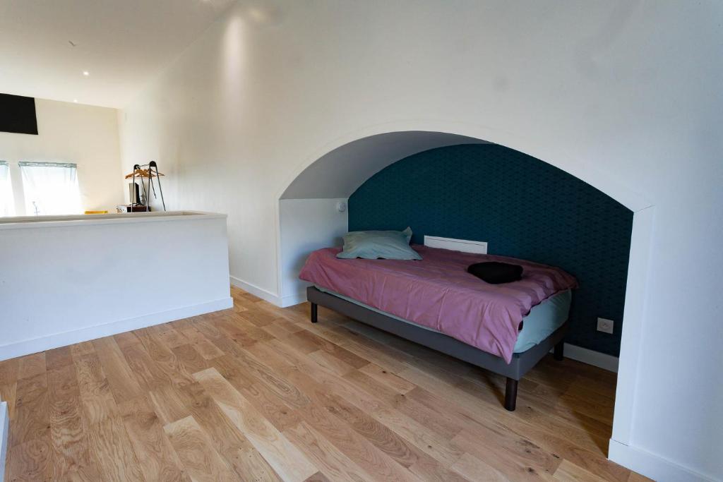 Postel nebo postele na pokoji v ubytování Gîte Le Pressoir