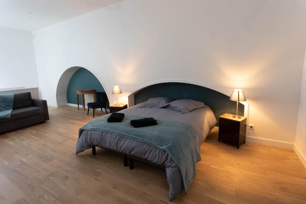 Postel nebo postele na pokoji v ubytování Gîte Le Pressoir