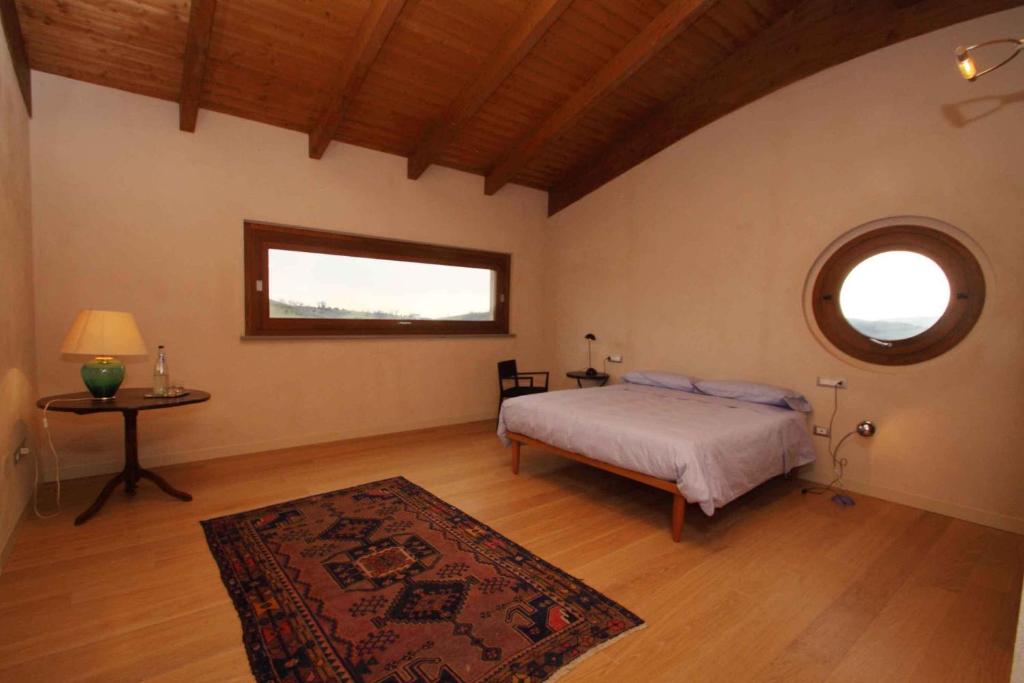 Postel nebo postele na pokoji v ubytování Agriturismo Cignale