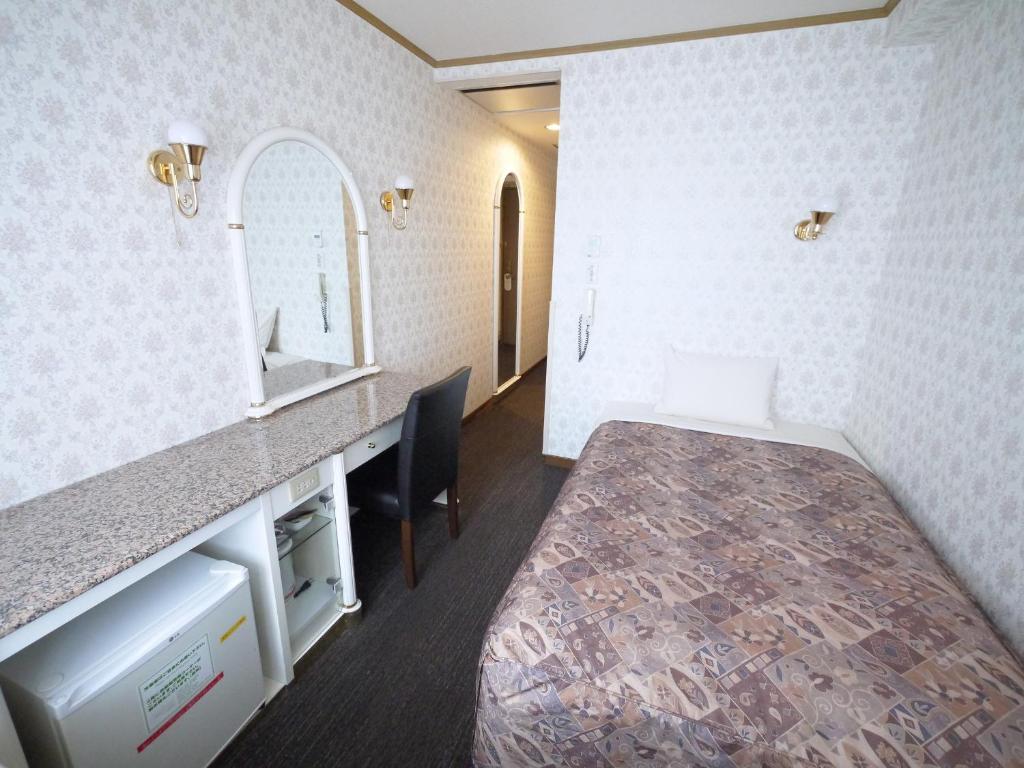 Postel nebo postele na pokoji v ubytování U-Community Hotel