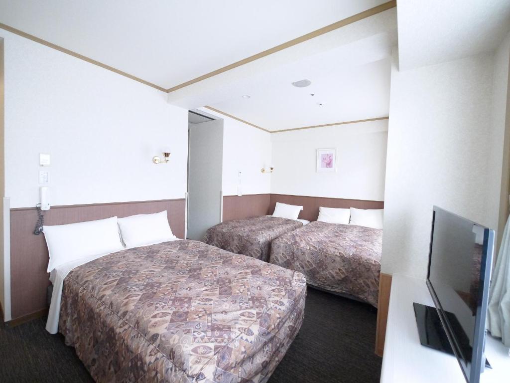TV a/nebo společenská místnost v ubytování U-Community Hotel