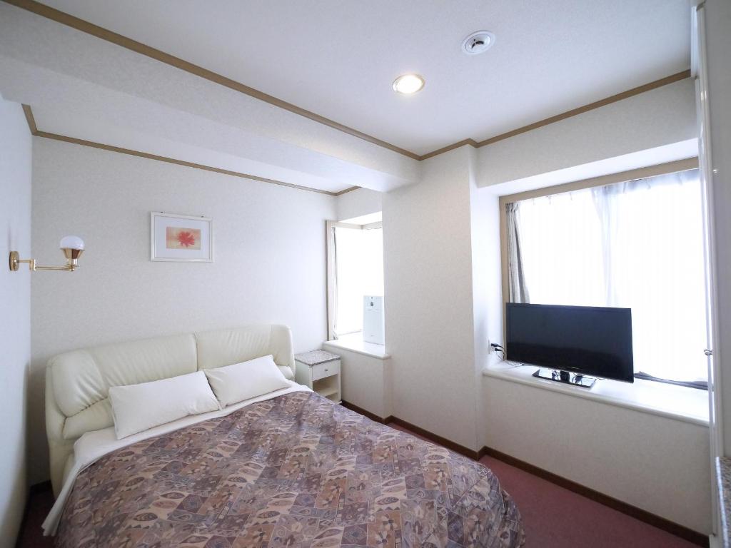 TV a/nebo společenská místnost v ubytování U-Community Hotel