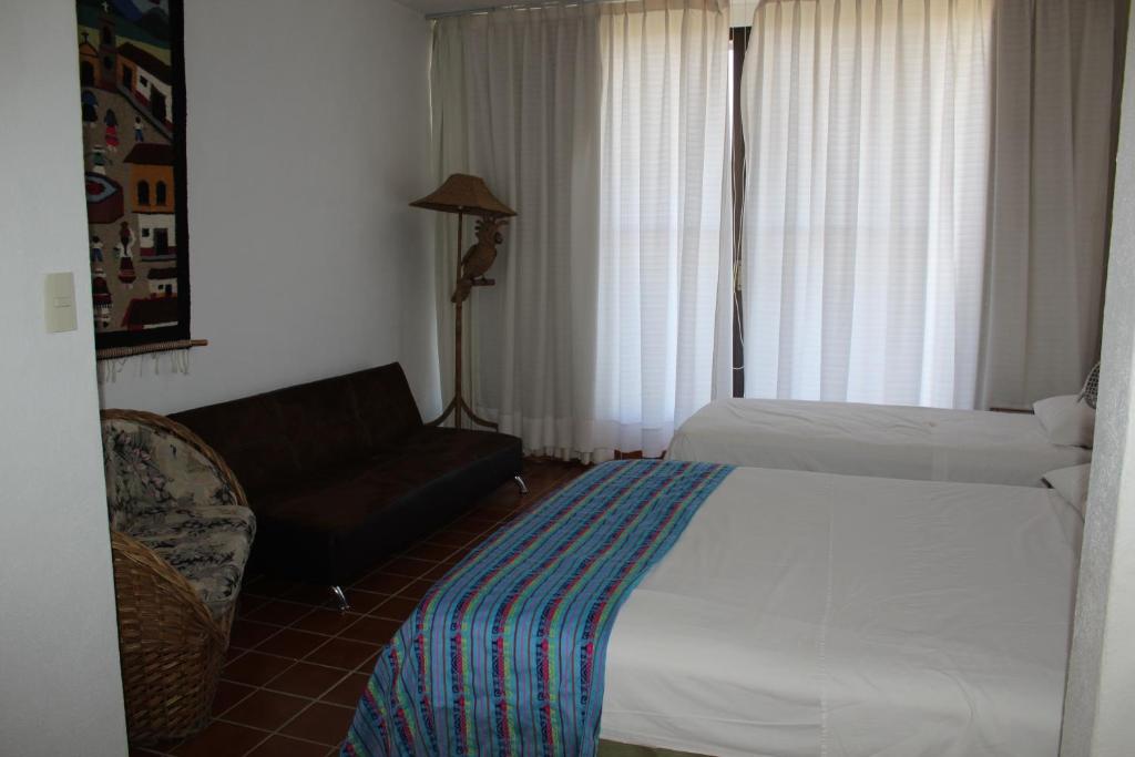 Postel nebo postele na pokoji v ubytování Villa La Loma