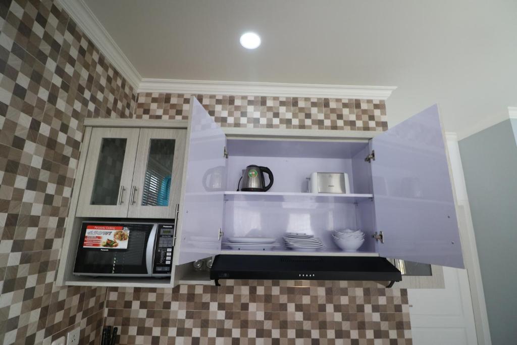 Kuchyň nebo kuchyňský kout v ubytování Diyar Villas Puncak F4/8