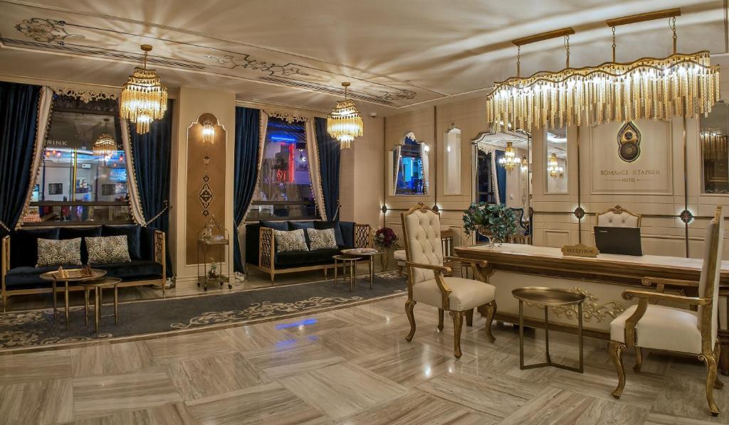 a large room with a salon with a table and chairs at Romance Istanbul Hotel Boutique Class in Istanbul