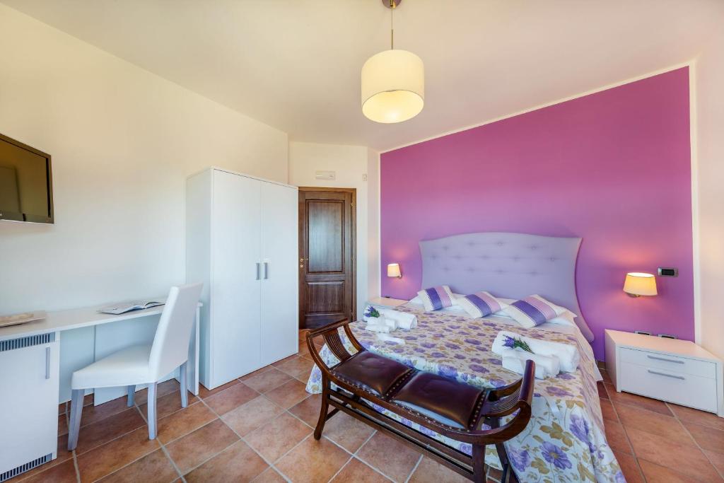 Łóżko lub łóżka w pokoju w obiekcie Casa Vacanza Villa Aurora