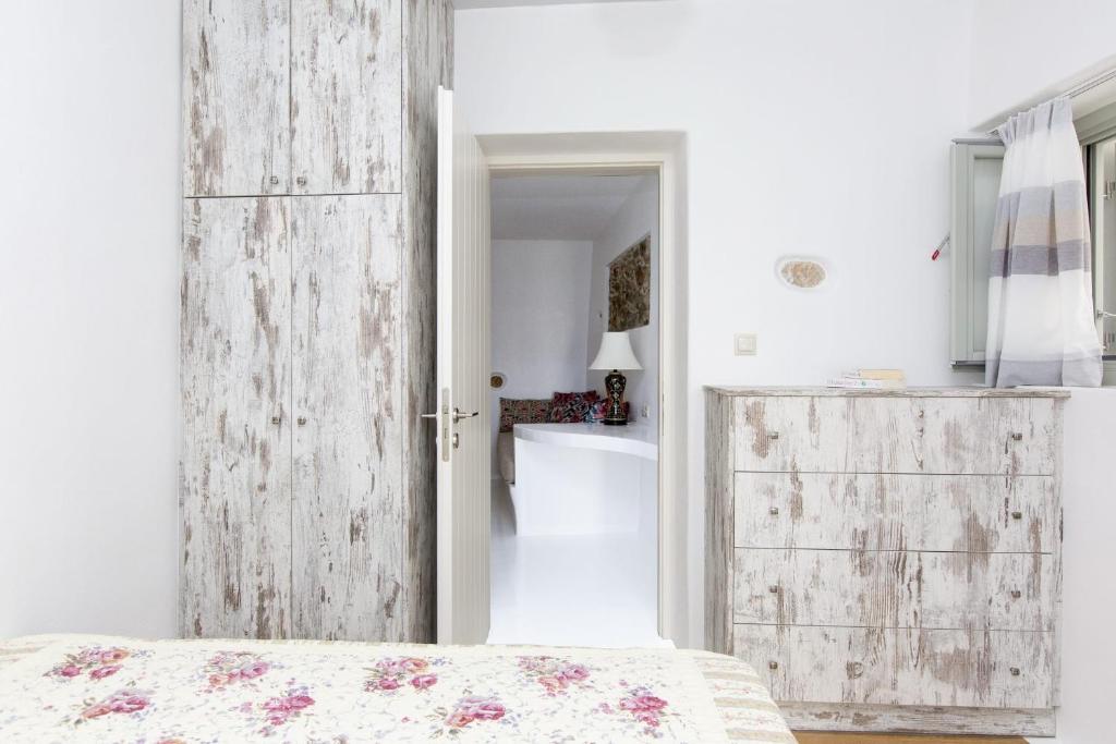 Postel nebo postele na pokoji v ubytování Aegean White Home