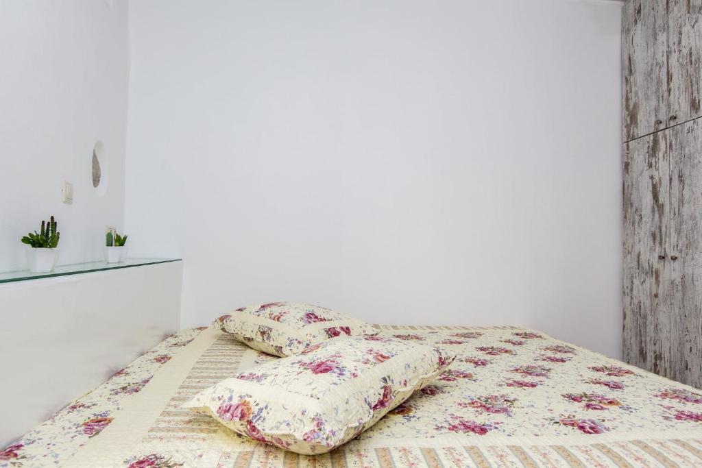 Postel nebo postele na pokoji v ubytování Aegean White Home