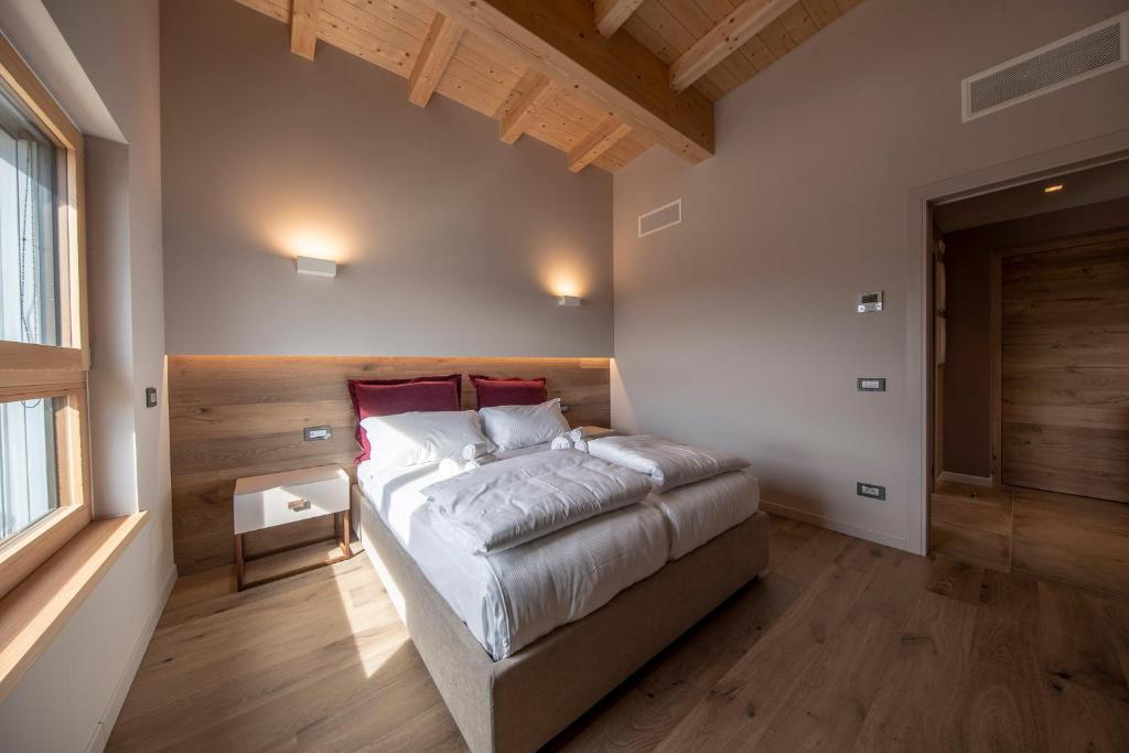 Posteľ alebo postele v izbe v ubytovaní COBUE "Wine resort & Spa"
