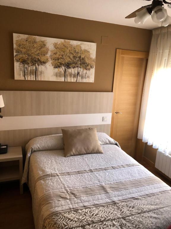 Postel nebo postele na pokoji v ubytování Hotel Bahia