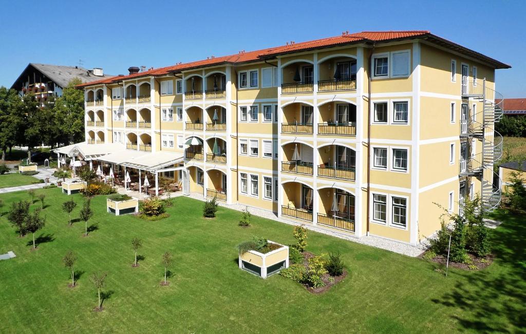 an aerial view of a large yellow building at Europa Residenz in Bad Füssing