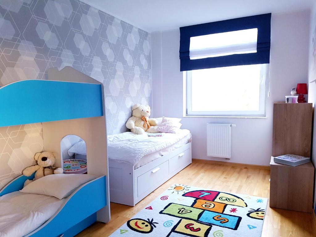 Posteľ alebo postele v izbe v ubytovaní ApartMorze apartamenty Fregata
