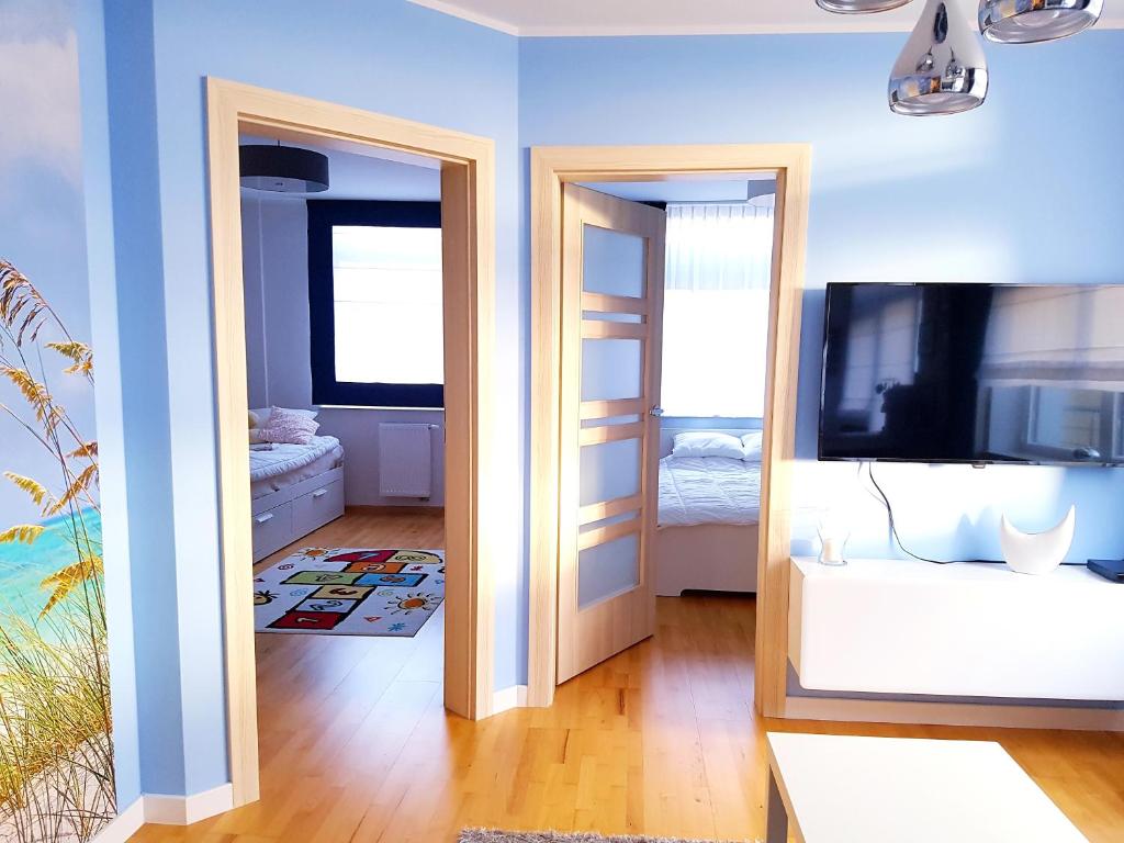 Posteľ alebo postele v izbe v ubytovaní ApartMorze apartamenty Fregata