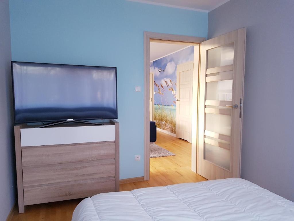 Posteľ alebo postele v izbe v ubytovaní ApartMorze apartamenty Fregata