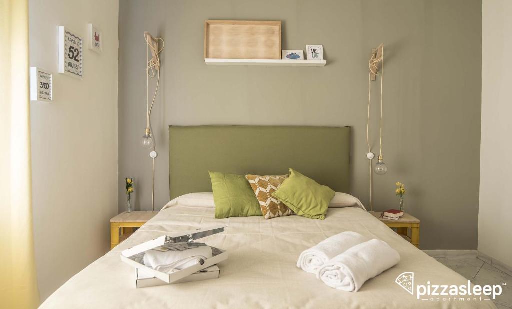 Posteľ alebo postele v izbe v ubytovaní PizzaSleep -apartment-
