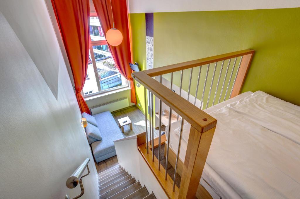 Postel nebo postele na pokoji v ubytování MEININGER Hotel Berlin Mitte
