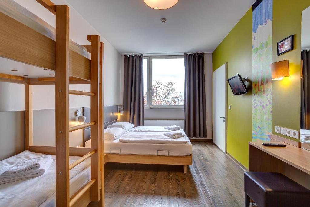 Postel nebo postele na pokoji v ubytování MEININGER Hotel Berlin Mitte