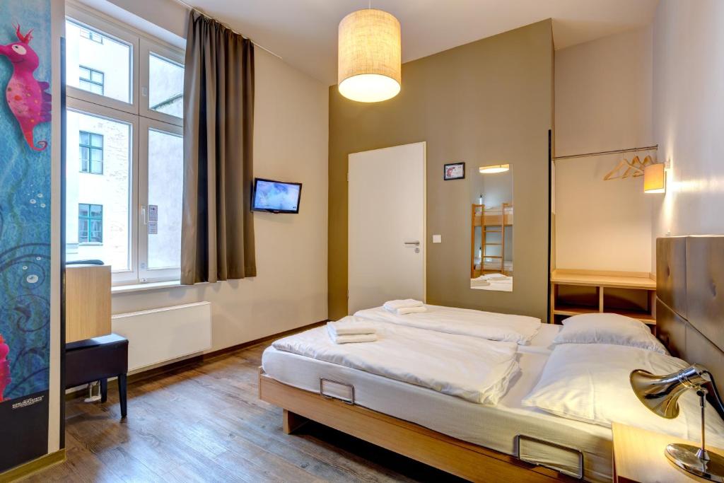 Postel nebo postele na pokoji v ubytování MEININGER Hotel Berlin Mitte