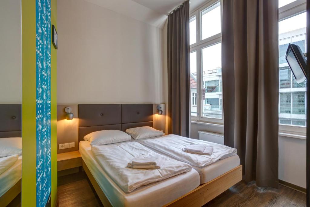 Postel nebo postele na pokoji v ubytování MEININGER Hotel Berlin Mitte