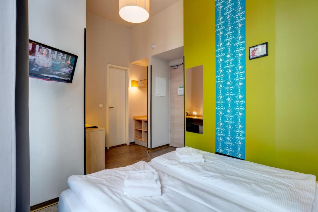 Postel nebo postele na pokoji v ubytování MEININGER Hotel Berlin Mitte