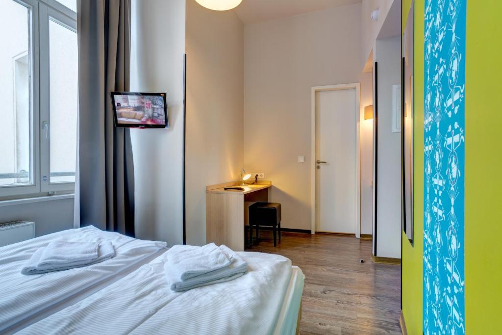 Postel nebo postele na pokoji v ubytování MEININGER Hotel Berlin Mitte