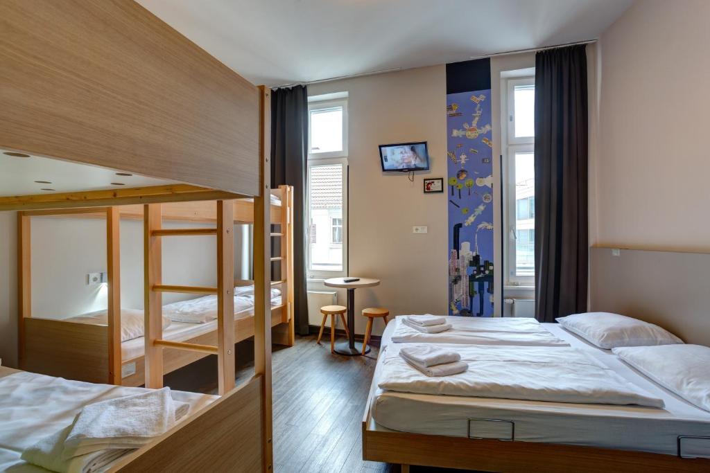 Postel nebo postele na pokoji v ubytování MEININGER Hotel Berlin Mitte