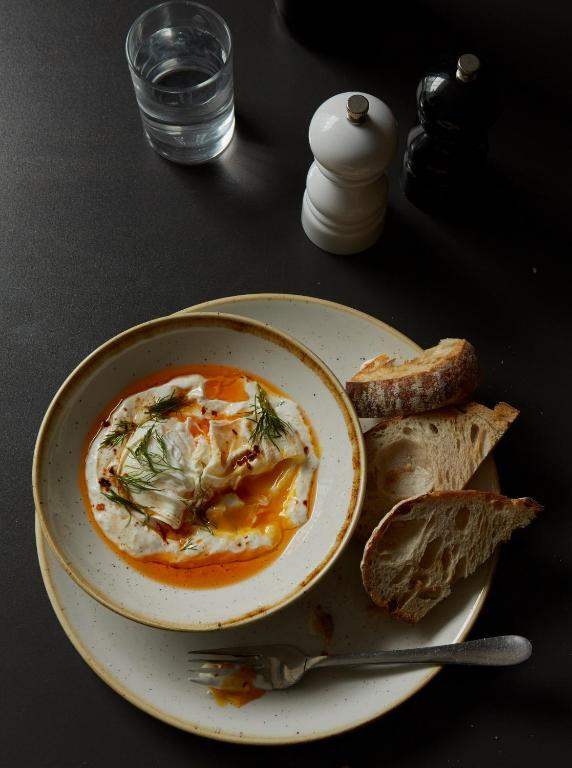 a plate of food with a bowl of soup and bread at Whitehouse Rye in Rye