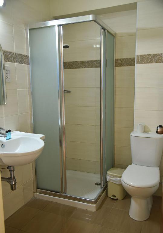Koupelna v ubytování Elysso Hotel