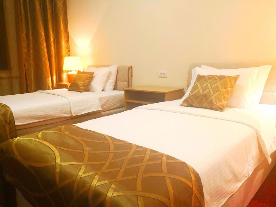 Postel nebo postele na pokoji v ubytování Hotel N