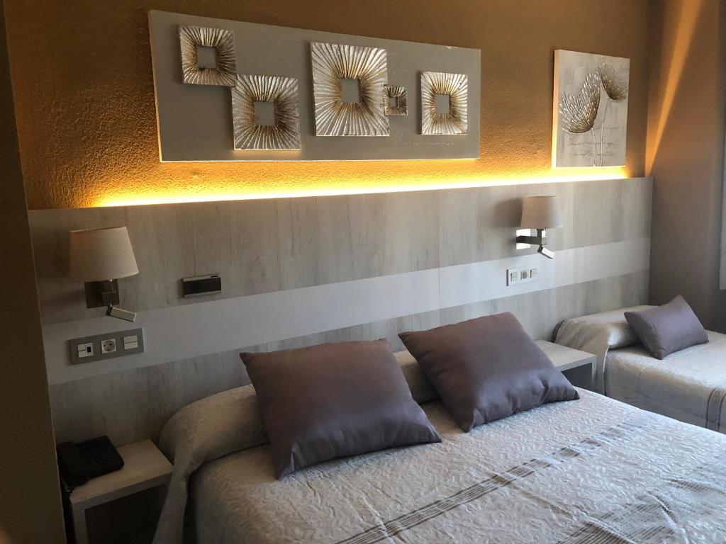 Postel nebo postele na pokoji v ubytování Hotel Bahia
