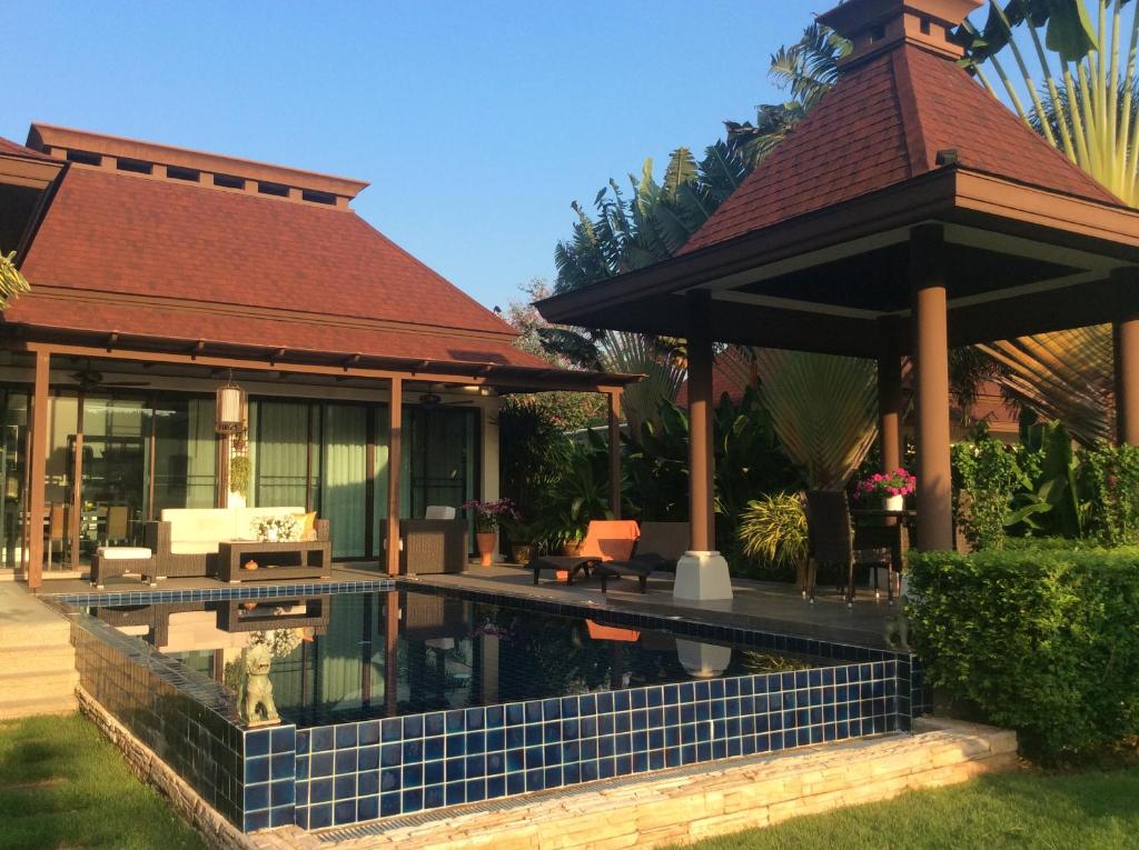 a house with a swimming pool and a gazebo at Panorama Pool Villa in Khao Tao