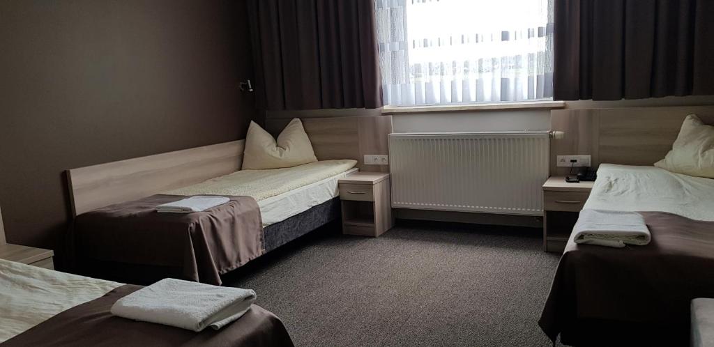 Postel nebo postele na pokoji v ubytování Zajazd Tytan